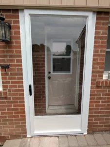 White full-lite storm door installed over an entry door in Mississauga